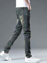 Men’s dark-wash denim slim fit jeans with distressed details offering a stylish and modern look