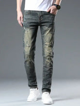 Men’s distressed slim fit dark wash denim jeans with intentional rips and fading for a stylish casual look