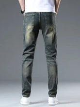 Men’s dark-wash denim distressed slim fit jeans featuring faded detailing and a modern slim-cut design
