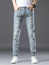 Men’s distressed slim fit jeans in light-wash denim with ripped details and a slim-fit cut