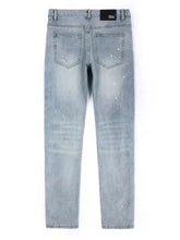 Men’s distressed slim fit jeans in light-wash denim with a speckled finish and slim-fit cut