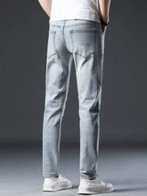 Men’s distressed slim fit light-wash denim jeans with subtle white speckle detailing for casual wear