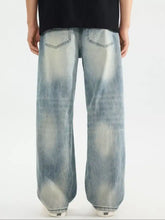 Men’s distressed vintage wash light-wash denim jeans with wide-leg relaxed fit and faded distressing