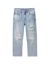 Men’s distressed washed wide leg jeans in light-wash denim with frayed rips at knees and thighs