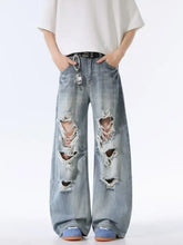 Men’s light-wash denim distressed wide leg jeans with ripped knees and frayed edges made of durable cotton