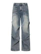 Men’s distressed wide leg jeans in faded blue denim with cargo pockets and reinforced stitching