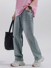 Men’s light-wash denim wide leg jeans with relaxed straight-leg cut and subtle fading for casual wear