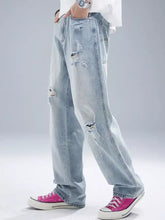 Men’s distressed wide leg jeans in light-wash denim with ripped details and a relaxed straight-leg cut