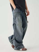 Men’s distressed wide-leg jeans in faded dark blue denim with visible stitching and cargo-style pockets