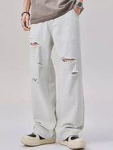 Men’s distressed wide leg jeans in light-wash denim with ripped details on thighs and knees for a casual look