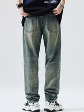 Distressed olive green denim men’s distressed wide leg relaxed fit jeans showing classic back pockets