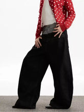 Men’s black wide leg jeans with a high waist and relaxed fit made of denim fabric