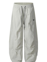 Mens drawstring breathable curved pants in light grey with black and white drawstring