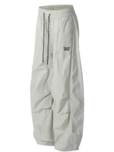 Light gray oversized mens drawstring breathable curved pants with black and white drawstring