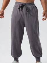 Dark gray mens drawstring joggers with elastic cuffs