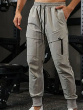 Light grey mens drawstring joggers with zippered cargo pockets