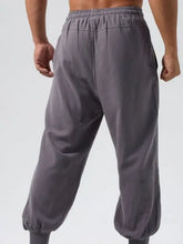 Mens drawstring joggers: loose-fit gray casual pants with elastic waistband and cuffs