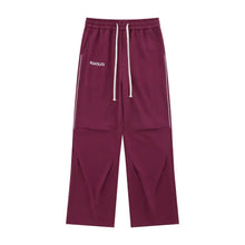 Mens drawstring pants in maroon with white side stripes and pockets