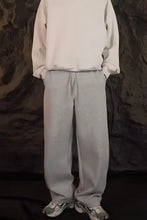 Mens drawstring straight-leg sweatpants in basic style with grey sweatshirt and sneakers