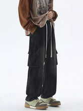 Men’s black denim drawstring wash wide leg jeans with large side cargo pockets and white drawstring