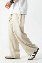 Mens drawstring wide leg pants in loose-fit beige cargo style