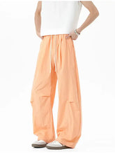 Mens elastic waist wide leg pants in peach with white drawstring