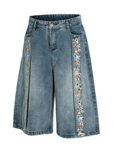 Mens floral trim wide leg denim shorts with blue denim and colorful floral embroidery