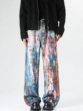 Men’s full size abstract art print wide leg jeans featuring vibrant blue red and white paint-splatter pattern