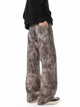 Men’s full size abstract print wide leg jeans in mottled gray and brown soft fabric with visible stitching