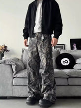 Men’s full size camo print relaxed fit cargo pants in black and gray camouflage pattern with a relaxed fit