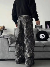 Men’s full size camo print relaxed fit cargo pants in black and gray camouflage with a wide leg design