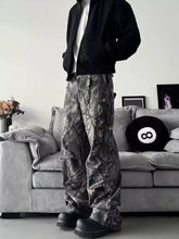 Men’s full size camo print relaxed fit cargo pants in black and gray camouflage pattern with a comfortable design