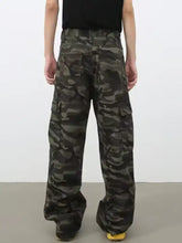 Men’s full size camo print wide leg cargo jeans in muted green and brown with multiple pockets and relaxed fit