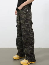 Men’s full size camo print wide leg cargo jeans in dark green and black with multiple pockets for versatile wear