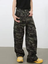 Men’s full size camo print wide leg cargo jeans in dark green and black camouflage with multiple pockets
