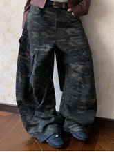 Men’s full size camo print wide leg cargo pants in dark green and black with a relaxed, wide leg cut