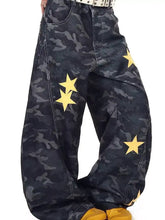 Men’s dark blue denim baggy jeans with camo star print and bold yellow star appliqués in plus size