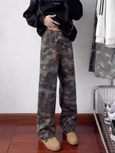Men’s full size camouflage wide leg jeans featuring a faded multi-toned star and leaf pattern in wide leg jeans style