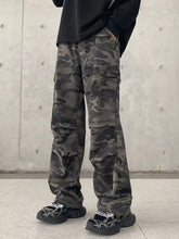 Men’s full size camouflage wide leg jeans in dark green and black with multiple cargo pockets