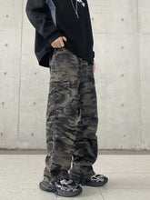 Men’s full size camouflage wide leg jeans in dark green and black with multiple cargo pockets