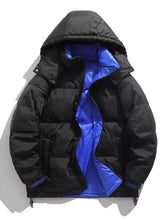 Men’s full size black puffer jacket with vibrant blue lining, subtle cuff branding, drawstring hem, and machine wash care