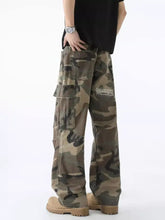 Men’s full size distressed camouflage wide leg jeans in earthy green and brown tones with a relaxed fit