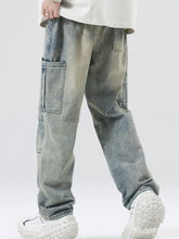 Men’s full size distressed cargo jeans in light-wash denim with multiple large pockets and a relaxed tapered fit