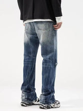 Men’s plus size distressed blue denim jeans with faded wash frayed cuffs and loose fit design