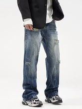 Men’s loose fit plus size distressed blue denim jeans with faded wash and intentional rips