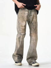 Men’s full size distressed gray denim loose fit jeans with faded patches and ripped distressed detailing