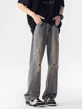 Men’s full size distressed loose fit gray denim jeans with ripped knee and relaxed straight-leg cut