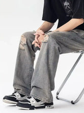 Men’s full size grey distressed loose fit denim jeans with ripped knees and relaxed fit in size distressed loose style