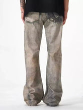 Men’s full size distressed jeans in washed-out gray denim with loose fit and subtle distressed detailing