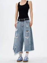 Men’s light-wash denim wide leg jeans with distressed raw hem and frayed holes plus size culottes style